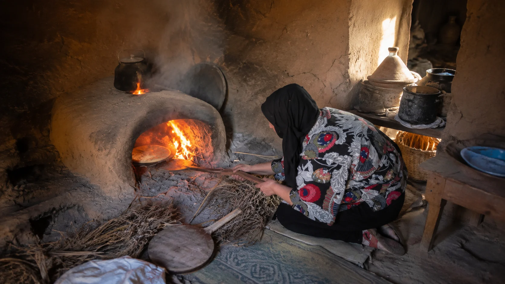 A traditional clay oven heated with wood and dry palm branches