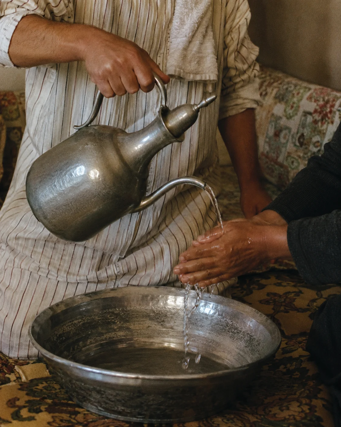 Traditional bakrach and basin used to wash hands before a family meal