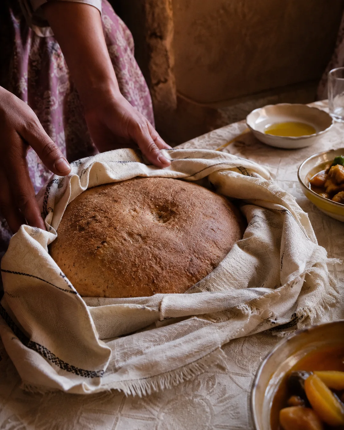Traditional homemade bread kept in cloth before being shared