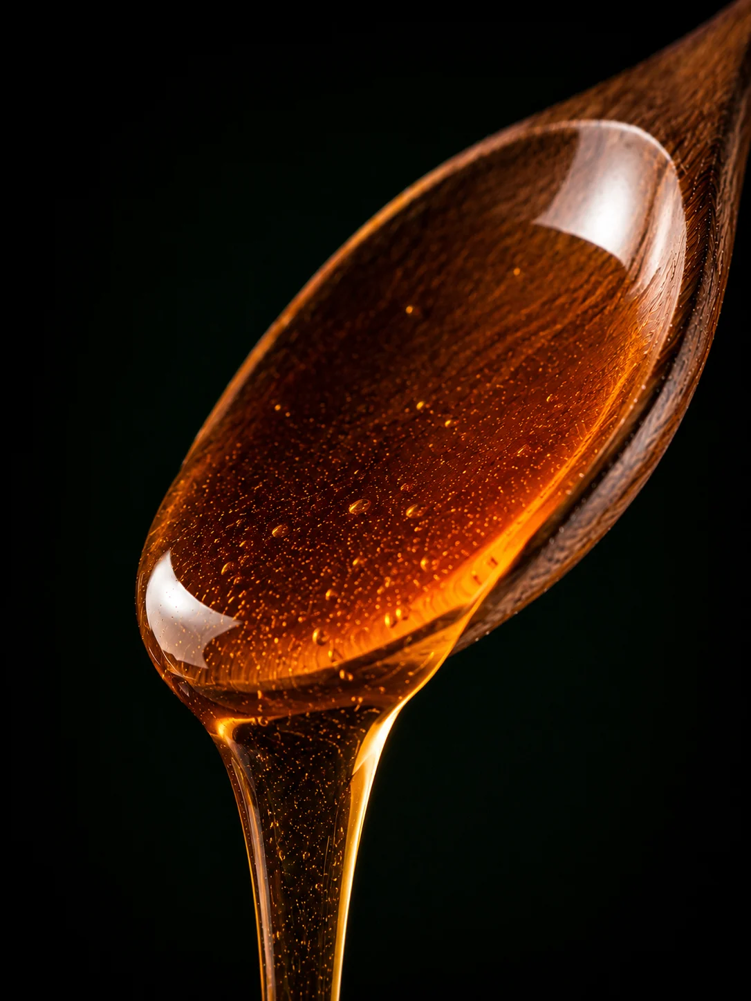 Amber Kilimanjaro forest honey on a spoon