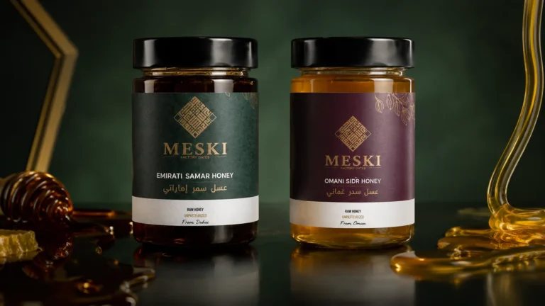 Emirati Samar honey and Omani Sidr honey compared side by side in a dark editorial setting